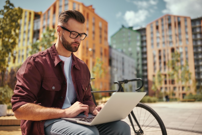 Man Glasses Shirt Laptop City