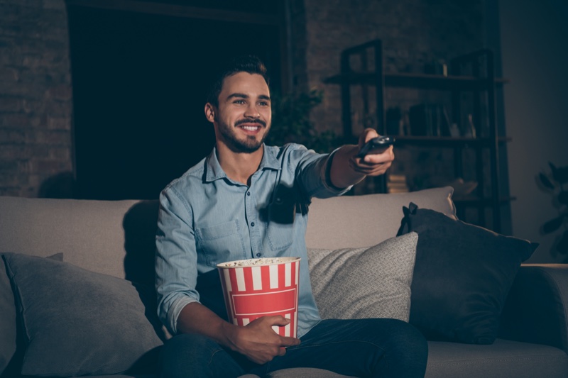 Man Watching Movie Popcorn Remote