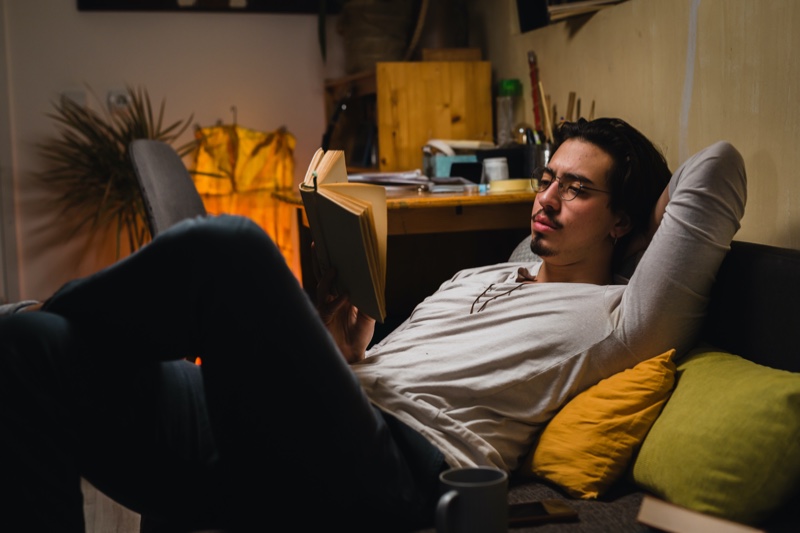 Young Man Reading Book Couch Young Man Reading Book Couch