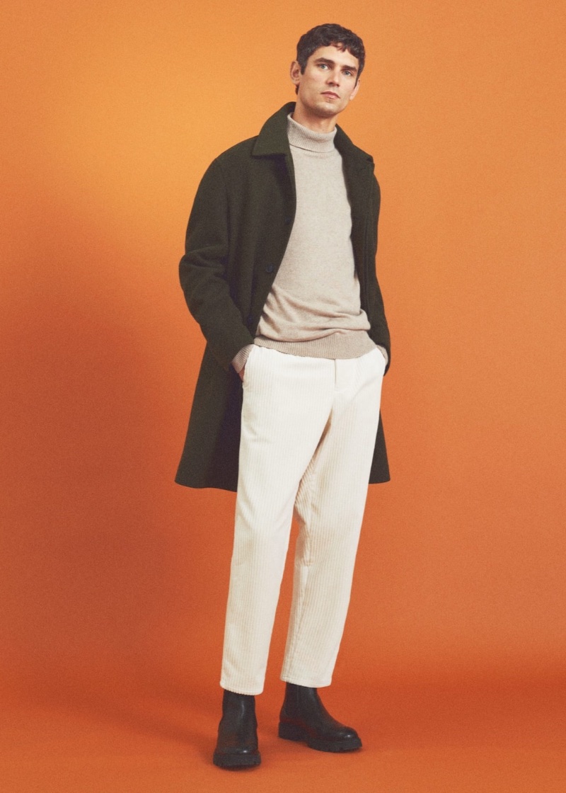 In front and center, Arthur Gosse sports a Mango Man detachable hood wool coat with regular-fit corduroy trousers.