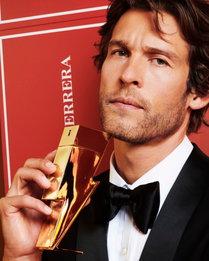 The face of Carolina Herrera's Bad Boy Gold Fantasy, Josh Upshaw takes hold of the new gold lightning bolt bottle. » Carolina Herrera's Bad Boy Dresses Up for the Holidays The face of Carolina Herrera's Bad Boy Gold Fantasy, Josh Upshaw takes hold of the new gold lightning bolt bottle.