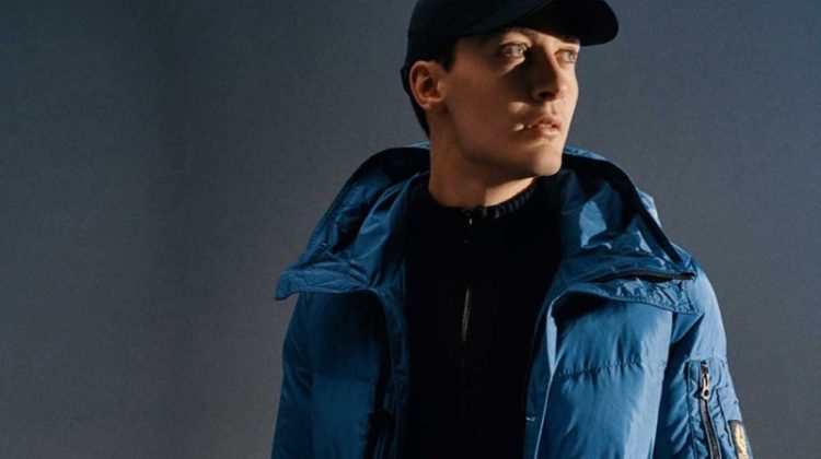 George Russell sports a blue quilted Belstaff jacket.