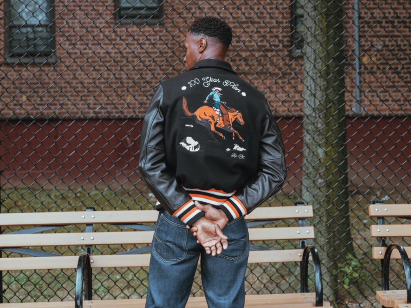 For its Lee collaboration, The Brooklyn Circus updates its popular varsity jacket with embroidery of a black cowboy.