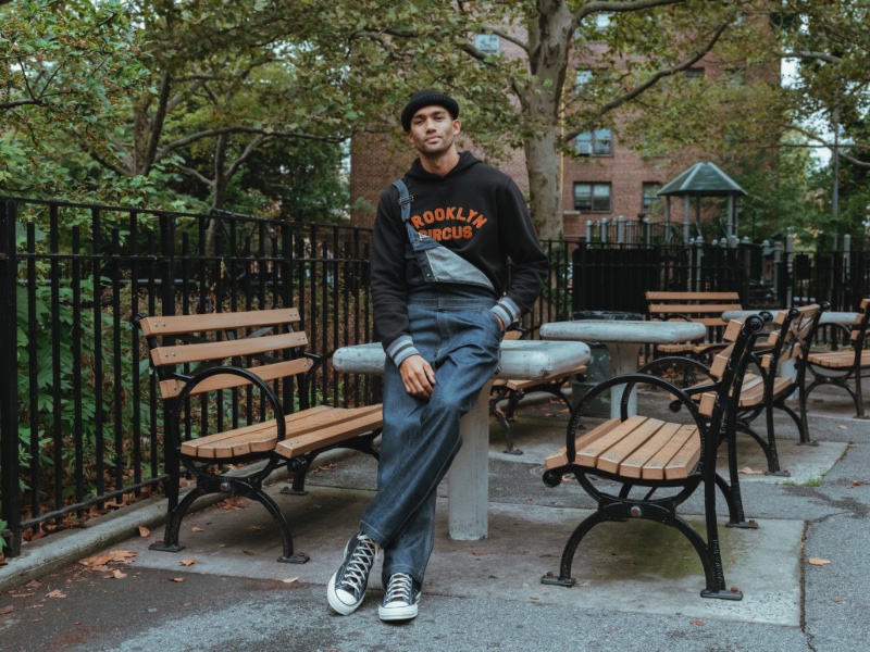 Dave Lilja wears overalls and a sweatshirt from the Lee x The Brooklyn Circus collection. 