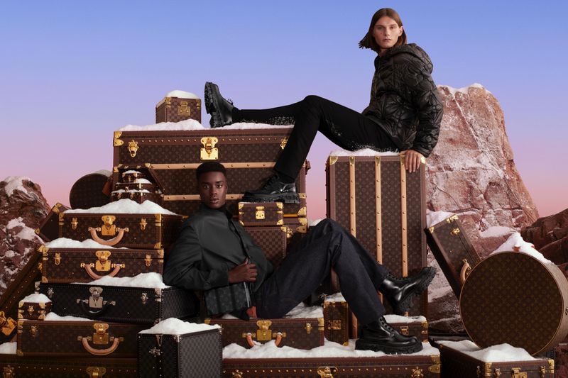 Babacar N'Doye and Teo Fortin pose on Louis Vuitton luggage trunks for the brand's holiday 2022 campaign. » The Magic of LV Takes the Spotlight for Louis Vuitton Holiday Ad Babacar N'Doye and Teo Fortin pose on Louis Vuitton luggage trunks for the brand's holiday 2022 campaign.