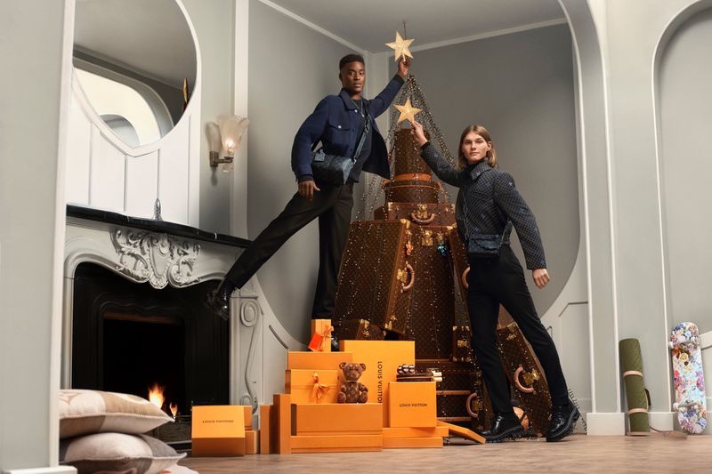 Decorating a luxurious Louis Vuitton Christmas tree, Babacar N'Doye and Teo Fortin front the brand's holiday 2022 campaign.