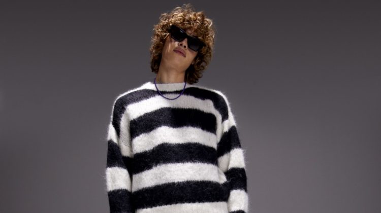 Making a statement in black and white, Arthur Kelso sports MOTHER's striped The Jumper sweater with The Neat jeans.