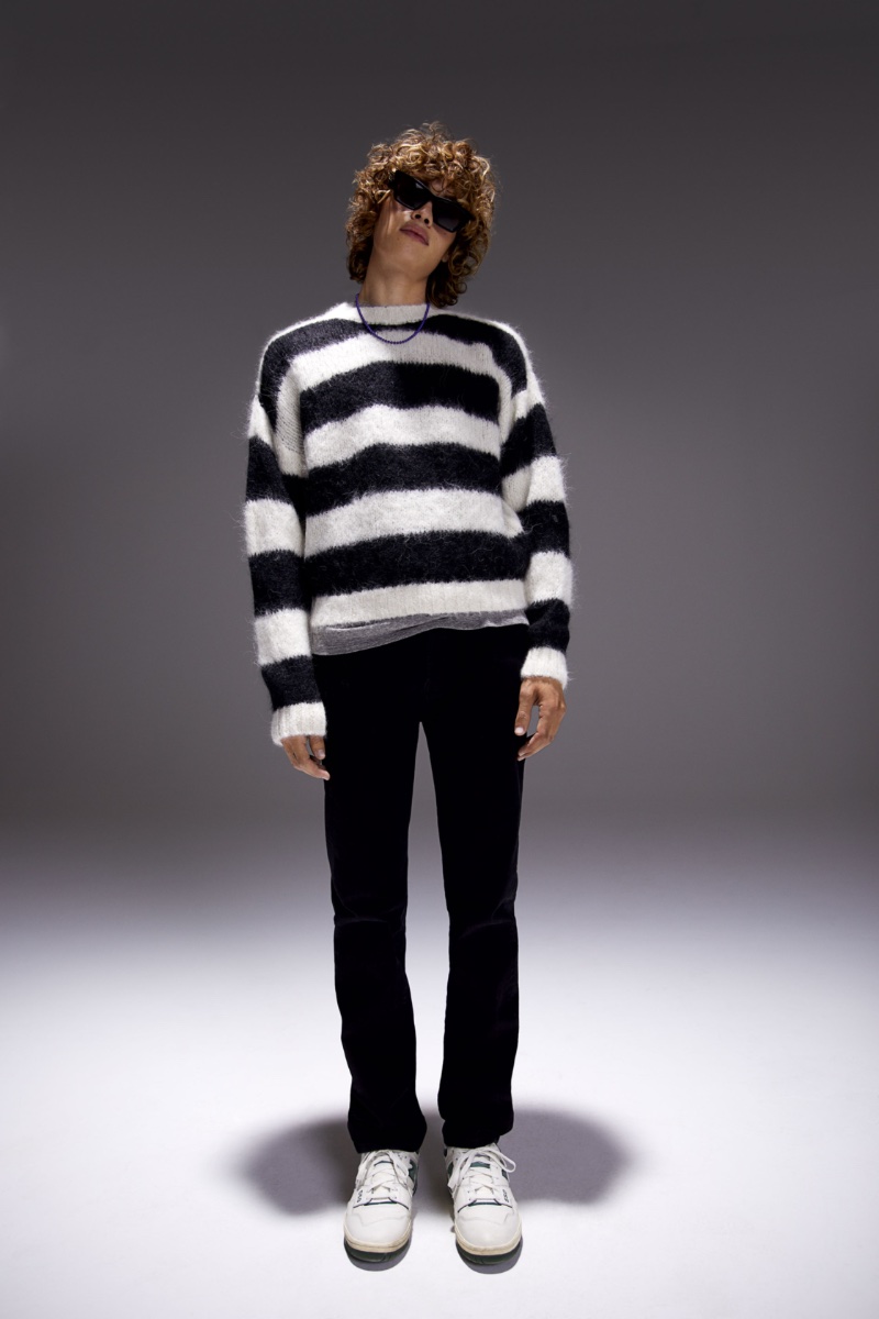 Making a statement in black and white, Arthur Kelso sports MOTHER's striped The Jumper sweater with The Neat jeans. 