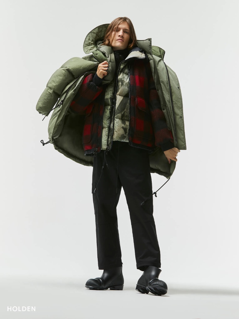 In front and center, Marcel Castenmiller sports a Holden long down puffer jacket with a plaid down field jacket and hooded down vest.
