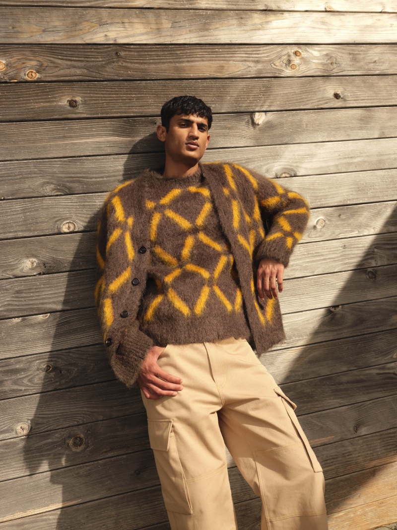 Making a case for CO-ORD style, Neeraj Saini wears a Marni x Mytheresa intarsia mohair-blend sweater and intarsia mohair-blend cardigan.