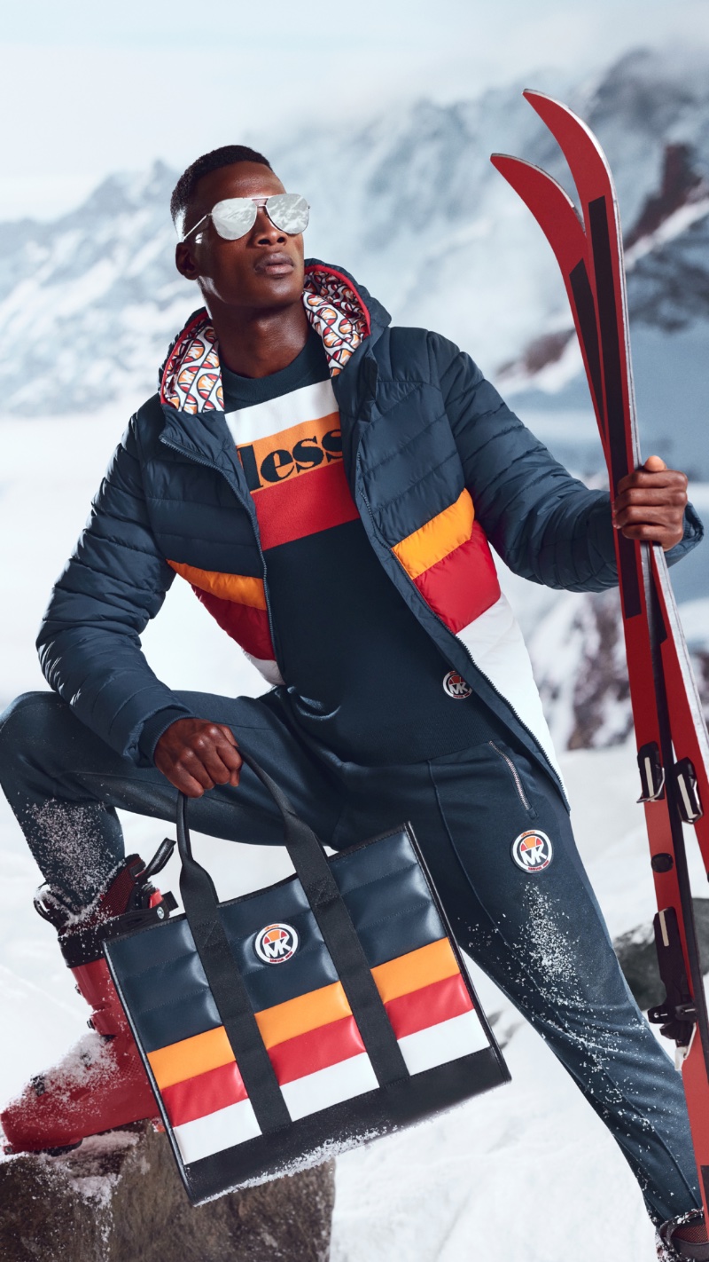 A stylish winter vision, David Agbodji appears in the Michael Kors x ellesse Ski capsule collection campaign.