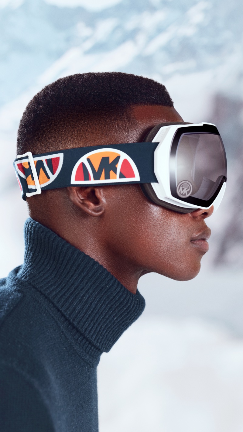Rocking ski goggles, David Agbodji fronts the Michael Kors x ellesse Ski capsule collection campaign.