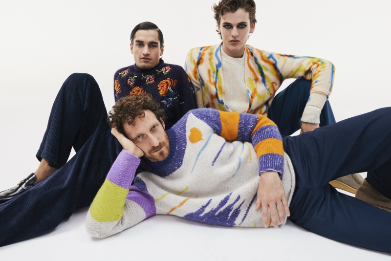 Left to Right: Iftach Vardi dons The Elder Statesman knitwear, Manu Kumar wears a Sacai sweater, and Conor Walmsley models a Dries van Noten sweater with a cardigan by The Elder Statesman for Mytheresa's holiday 2022 campaign.