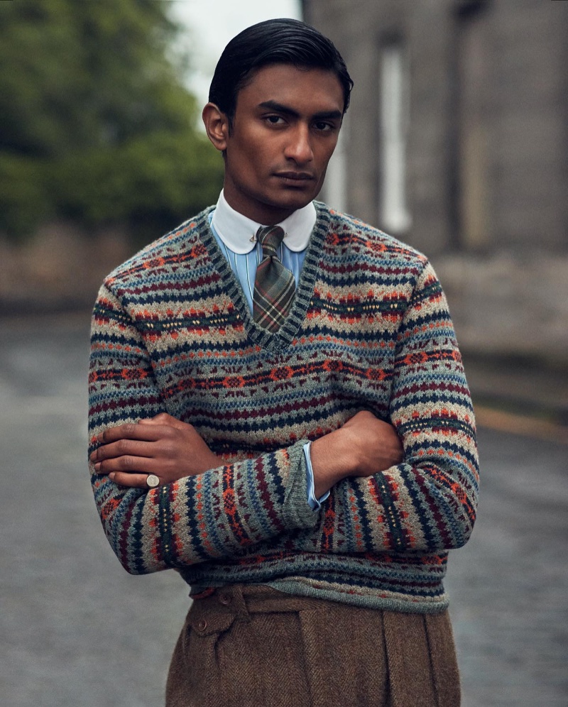 Embracing collegiate style in a v-neck sweater and tweed trousers, Rishi Robin fronts the Polo Originals Ralph Lauren campaign.