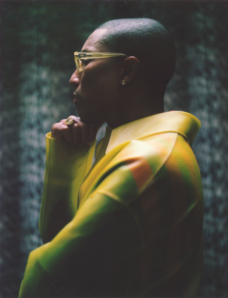 Delivering a side profile, Pharrell Williams rocks a Loewe coat and Gentle Monster sunglasses.