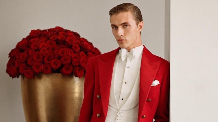 Lucky Blue Smith makes a splash in a red tailcoat jacket for Ralph Lauren's holiday 2022 campaign.