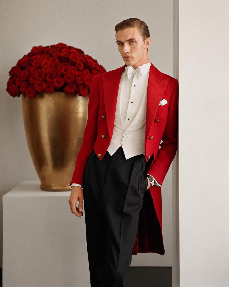 Lucky Blue Smith makes a splash in a red tailcoat jacket for Ralph Lauren's holiday 2022 campaign.
