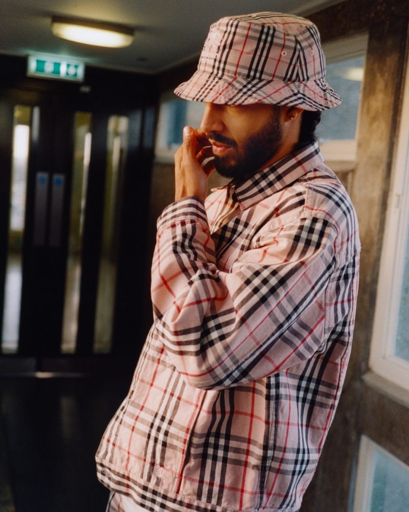 Sage Elsesser wears a check look from the 2022 Supreme x Burberry collaboration. 