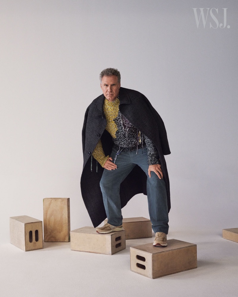 Actor Will Ferrell sports an AMI coat with an OAMC sweater, Loro Piana pants, and New Balance sneakers.