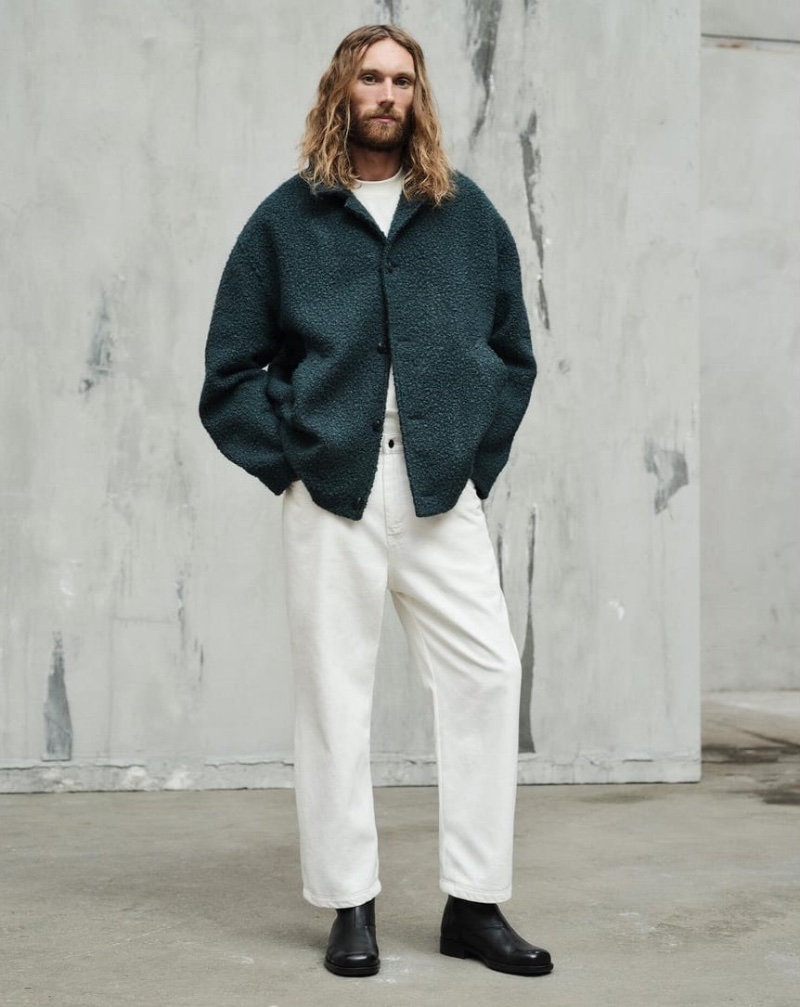 Model Aiden Andrews sports a textured jacket with white jeans from the Zara Edition capsule collection.