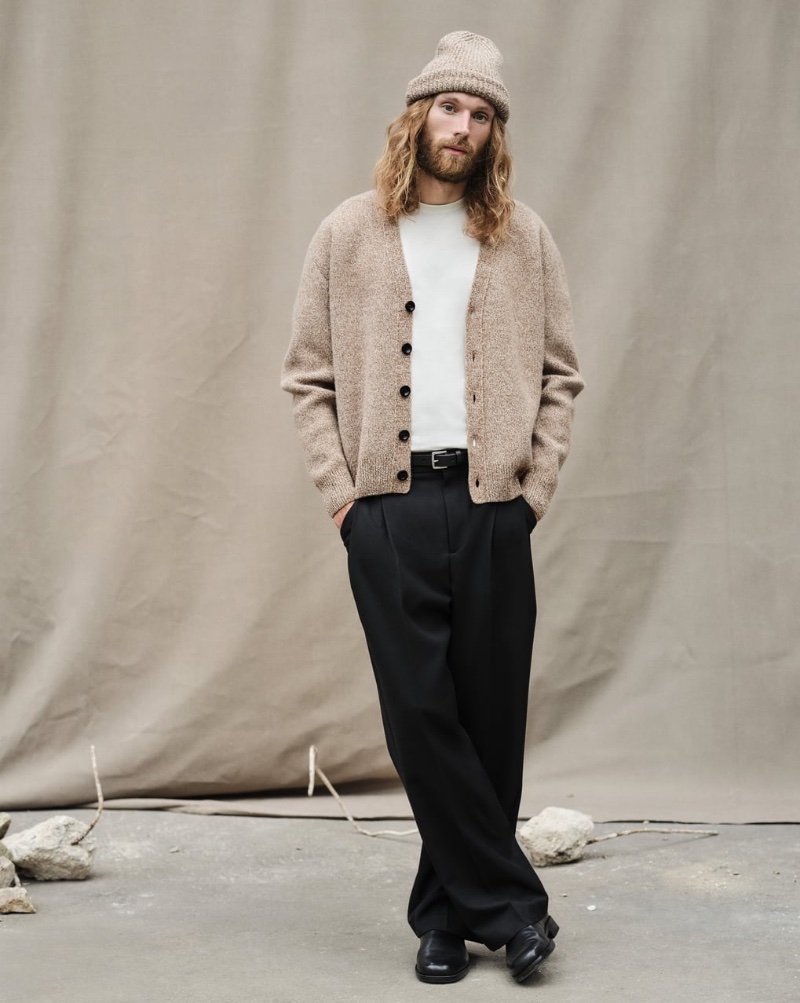 Aiden Andrews wears a cardigan with wide-cut pleated trousers from the Zara Edition capsule collection.