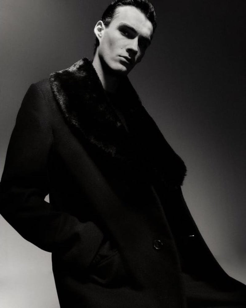 Victor Vuokko dons a Zara Man coat with a faux fur collar. 