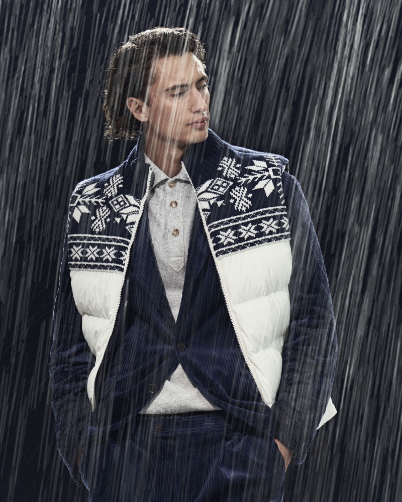 Embracing a winter vibe, James Turlington models a nylon down vest with a corduroy suit jacket and trousers.