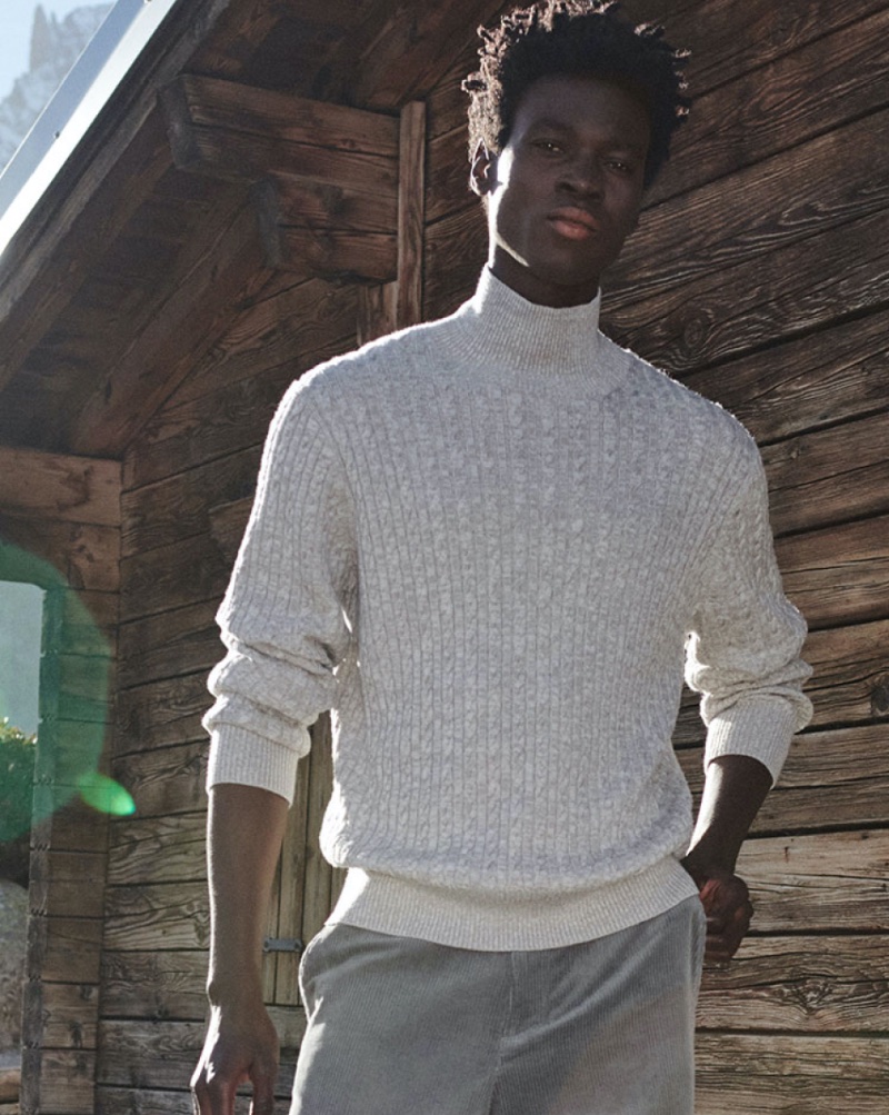 A chic vision, Felix Owusu models a cable-knit turtleneck sweater. » Clément & Felix Showcase COS' Winter Chic Wardrobe A chic vision, Felix Owusu models a cable-knit turtleneck sweater.