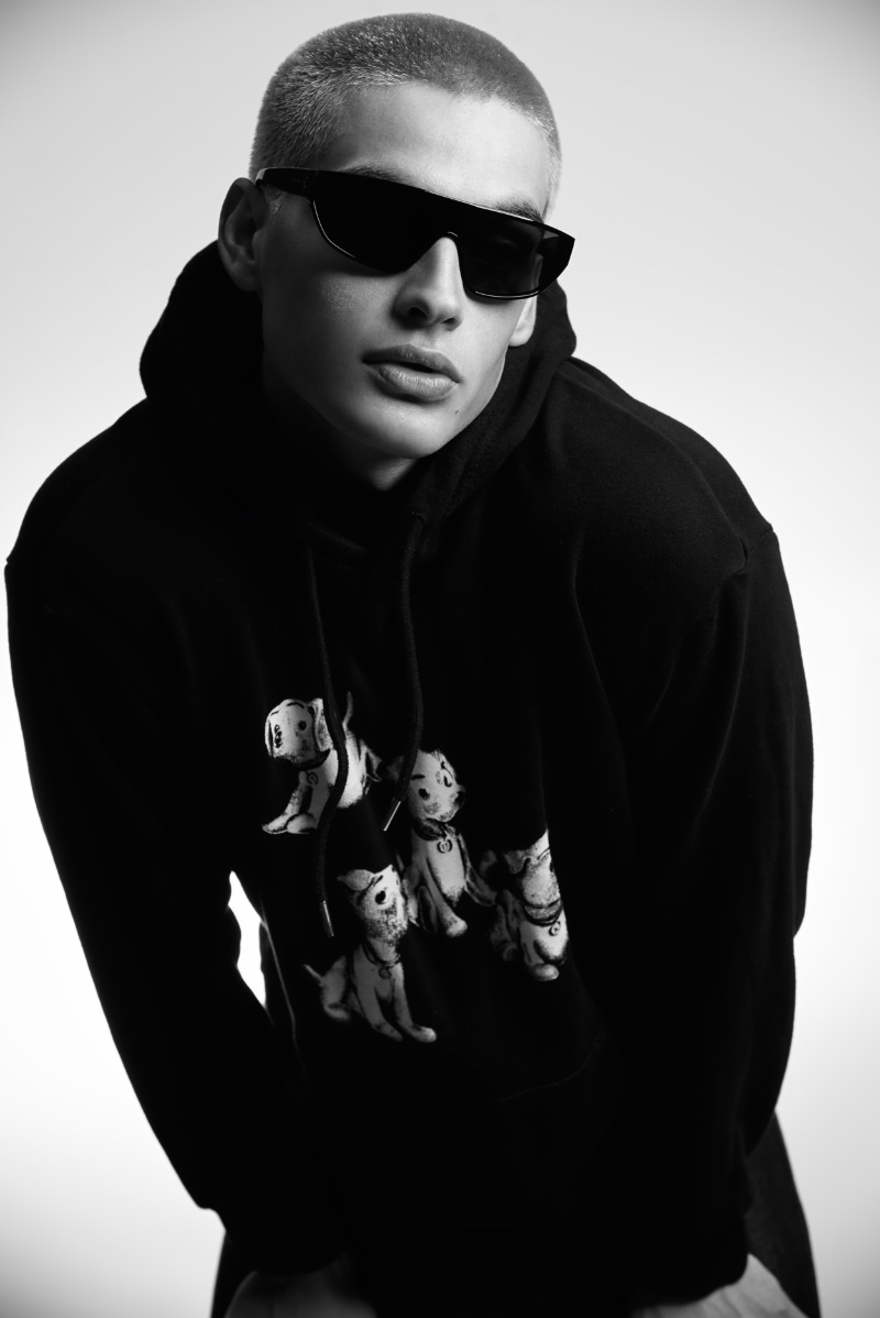 Cameron Porras Mens Folio 015 In front and center, Cameron Porras sports a Celine hoodie and sunglasses.