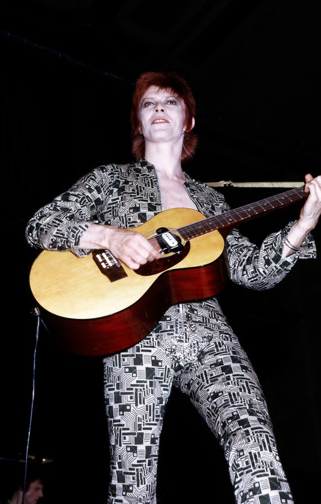 Embracing his Ziggy Stardust era, David Bowie performs at Newcastle in a jumpsuit designed by Freddie Burretti in 1972.