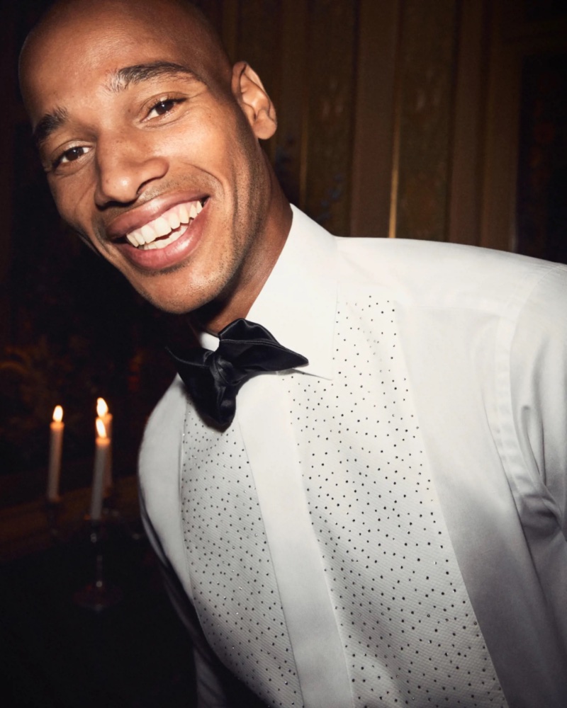 Sacha M'Baye wears a sharp tuxedo shirt for Eton's holiday 2022 campaign. » Eton Shares a Special Evening with Friends Sacha M'Baye wears a sharp tuxedo shirt for Eton's holiday 2022 campaign.