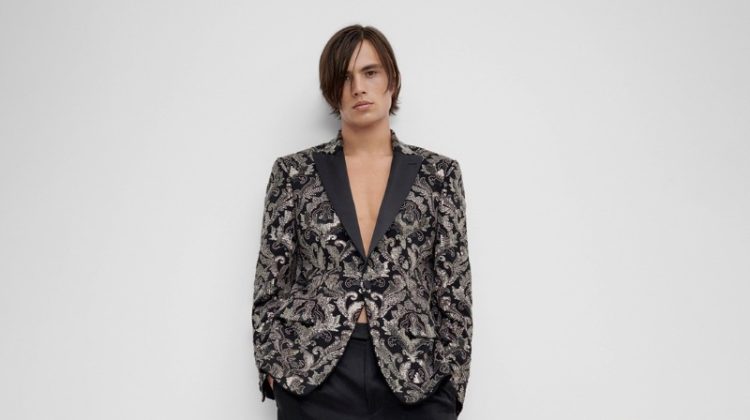 Louis Baines makes a sartorial statement in a jacquard jacket with tailored trousers.