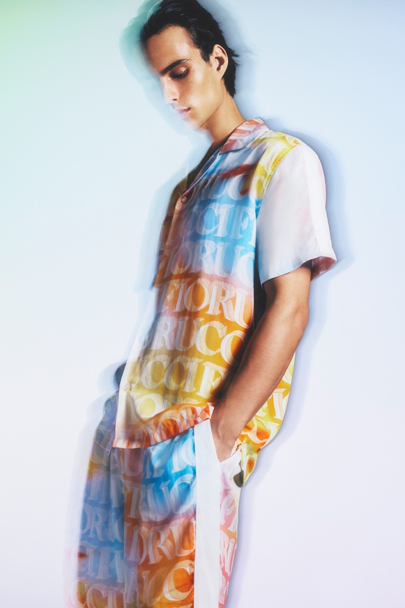 Embracing a sorbet color palette, Louis Baines wears a Fiorucci logo-print CO-ORD set for the brand's pre-spring 2023 campaign. » Louis Baines Turns Heads in Fiorucci Pre-Spring '23 Campaign Embracing a sorbet color palette, Louis Baines wears a Fiorucci logo-print CO-ORD set for the brand's pre-spring 2023 campaign.