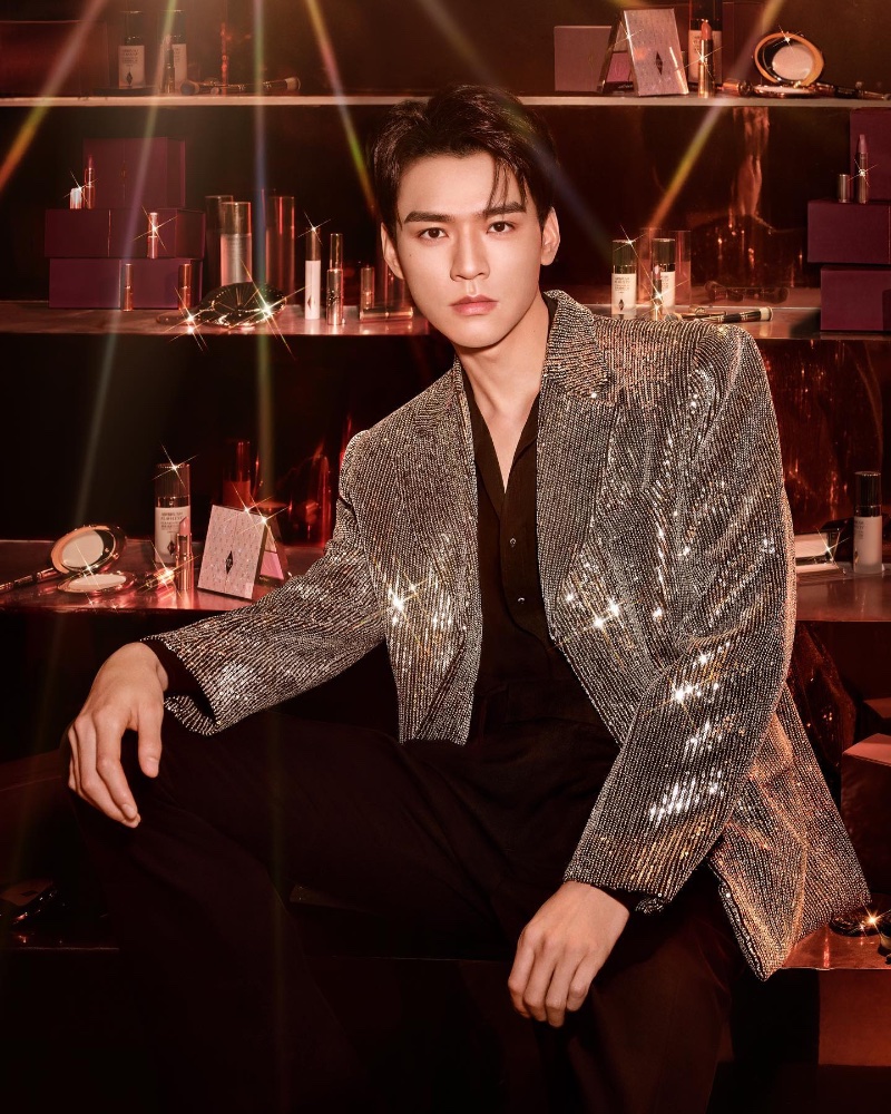 Gong Jun is a glam holiday vision in a silver dinner jacket for a new Charlotte Tilbury campaign.