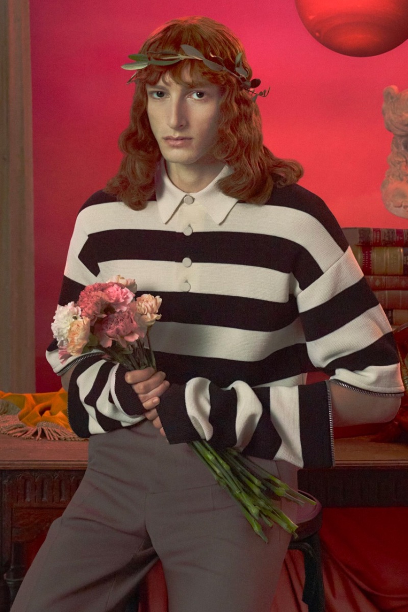 Joel Lumbroso wears a black-and-white striped polo for the Gucci Cosmogonie cruise 2023 campaign.