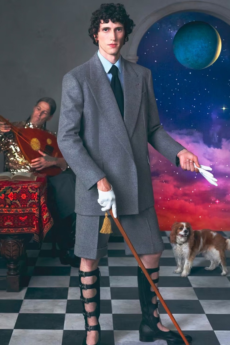 Joep dons a gray short suit with cut-out boots for the Gucci Cosmogonie cruise 2023 campaign.