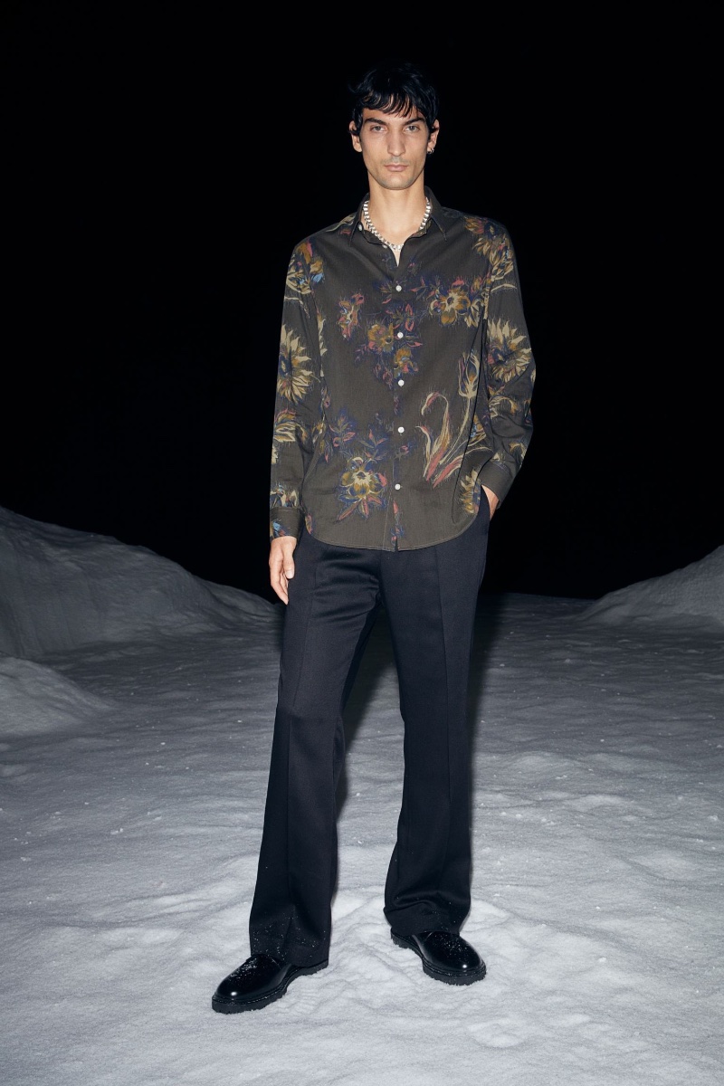 Connecting with H&M for the holidays, Luca Lemaire wears a floral print shirt with flared trousers. » Party Time! Explore H&M's Newest Men's Looks Connecting with H&M for the holidays, Luca Lemaire wears a floral print shirt with flared trousers.