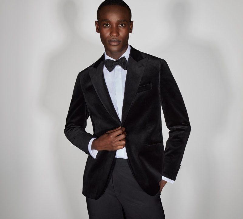 Dressed to impress, Charles Oduro wears a black velvet sport coat with black wool tuxedo trousers, and a knitted bow tie from Jack Victor.