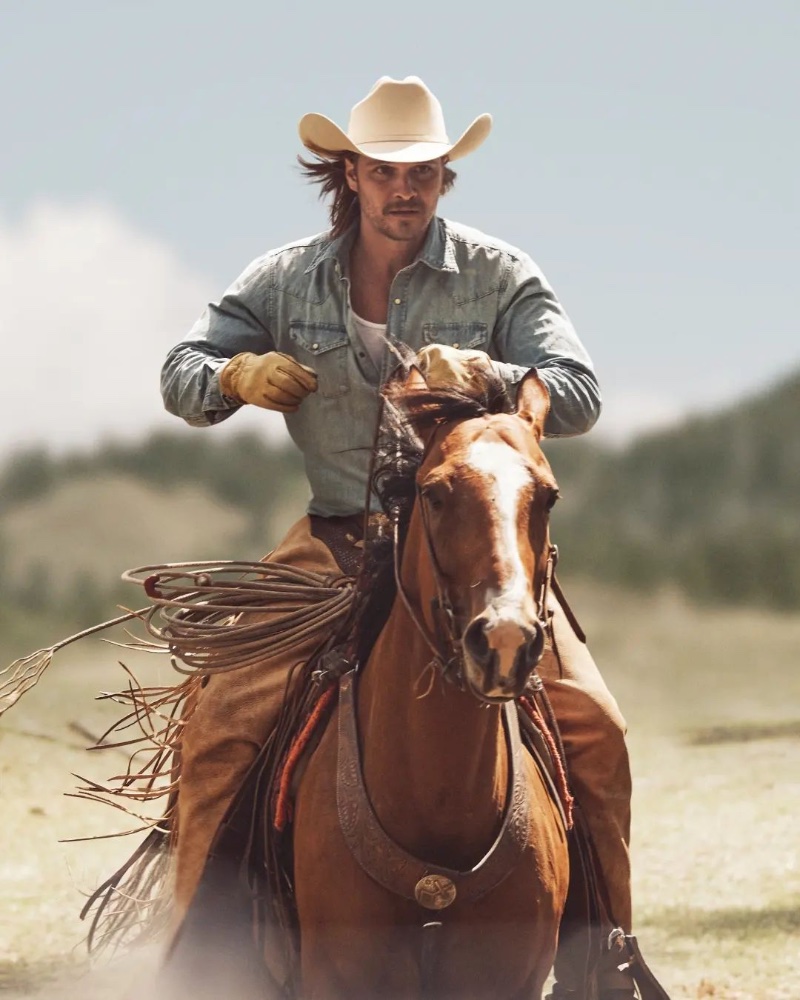 Riding a horse, Luke Grimes fronts the new Stetson Original cologne campaign.