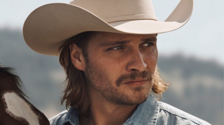 Luke Grimes fronts the Stetson Original cologne campaign. He wears a Stetson long-sleeved denim shirt and El Presidente 100x Premier cowboy hat.