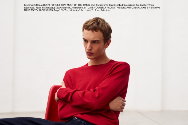 Model Maurits Buysse dons Massimo Dutti's crewneck sweater in red.