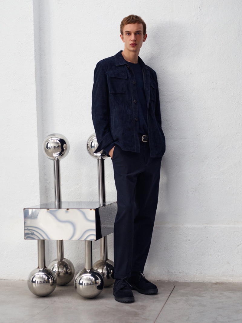 Maurits Buysse wears a suede overshirt with trousers by Massimo Dutti.