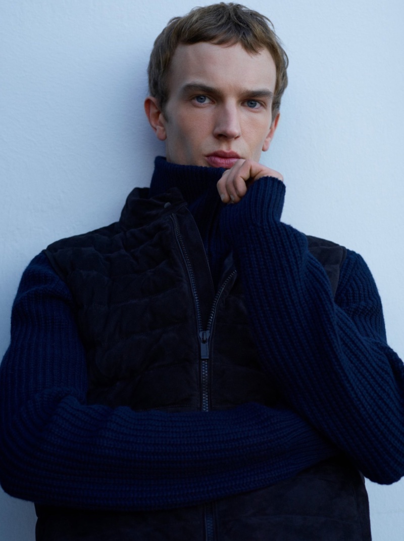 Layering for winter, Maurits Buysse wears a quilted vest over a ribbed knit pullover.