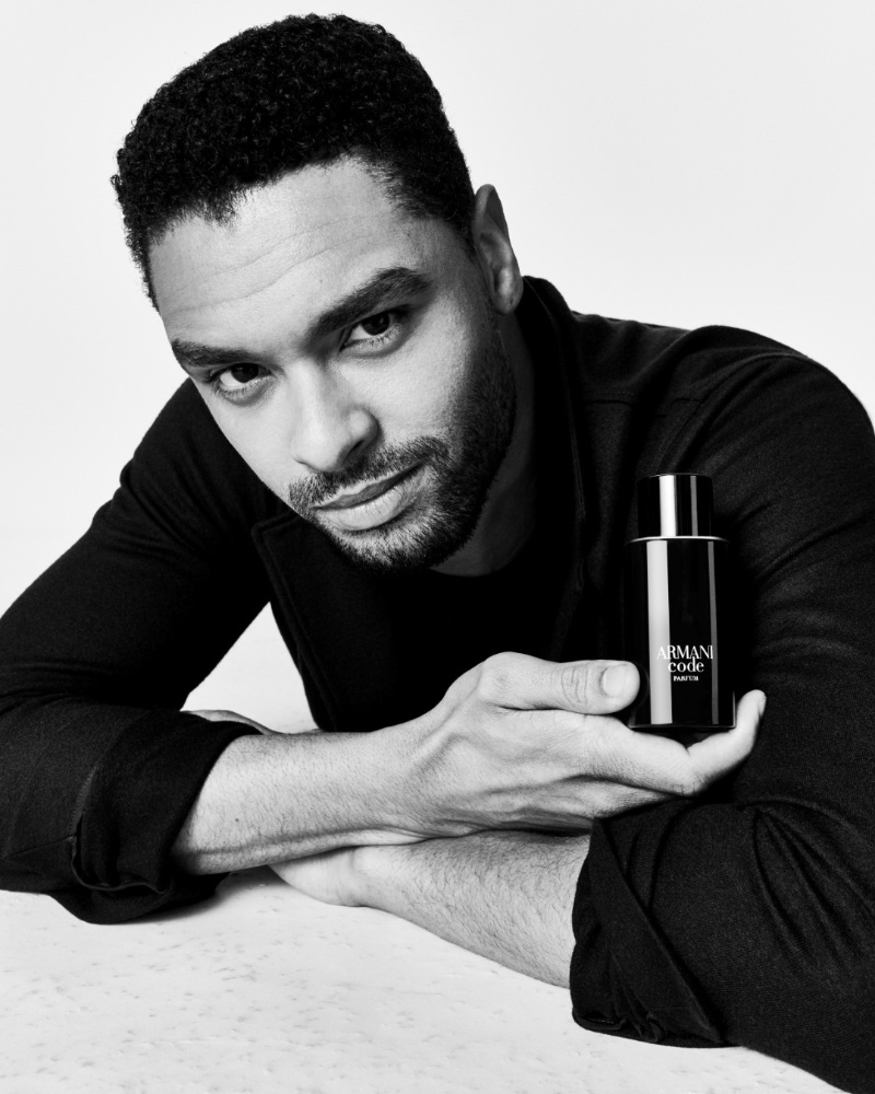 Regé-Jean Page appears in a black-and-white portrait as the face of Armani Code. 