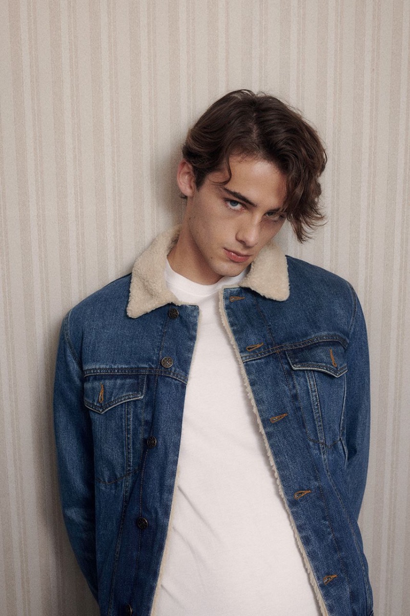 Embracing classic denim, William Franklyn-Miller rocks a blue denim jacket with a simple white t-shirt.