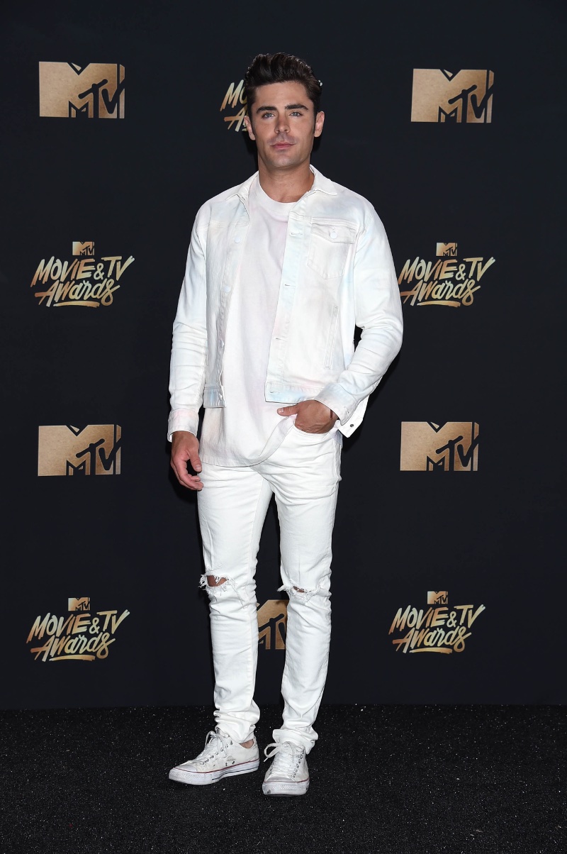 Zac Efron wears an all white denim outfit to the MTV Movie & TV Awards. 
