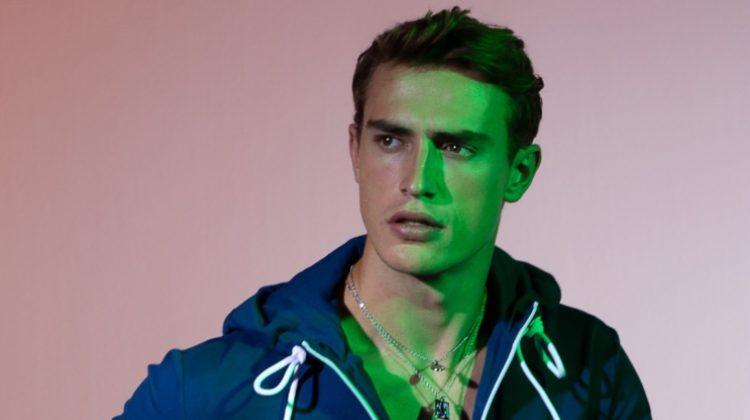 Sporty in a blue hoodie and track pants, Alex Verloop fronts Bikkembergs' spring-summer 2023 campaign.