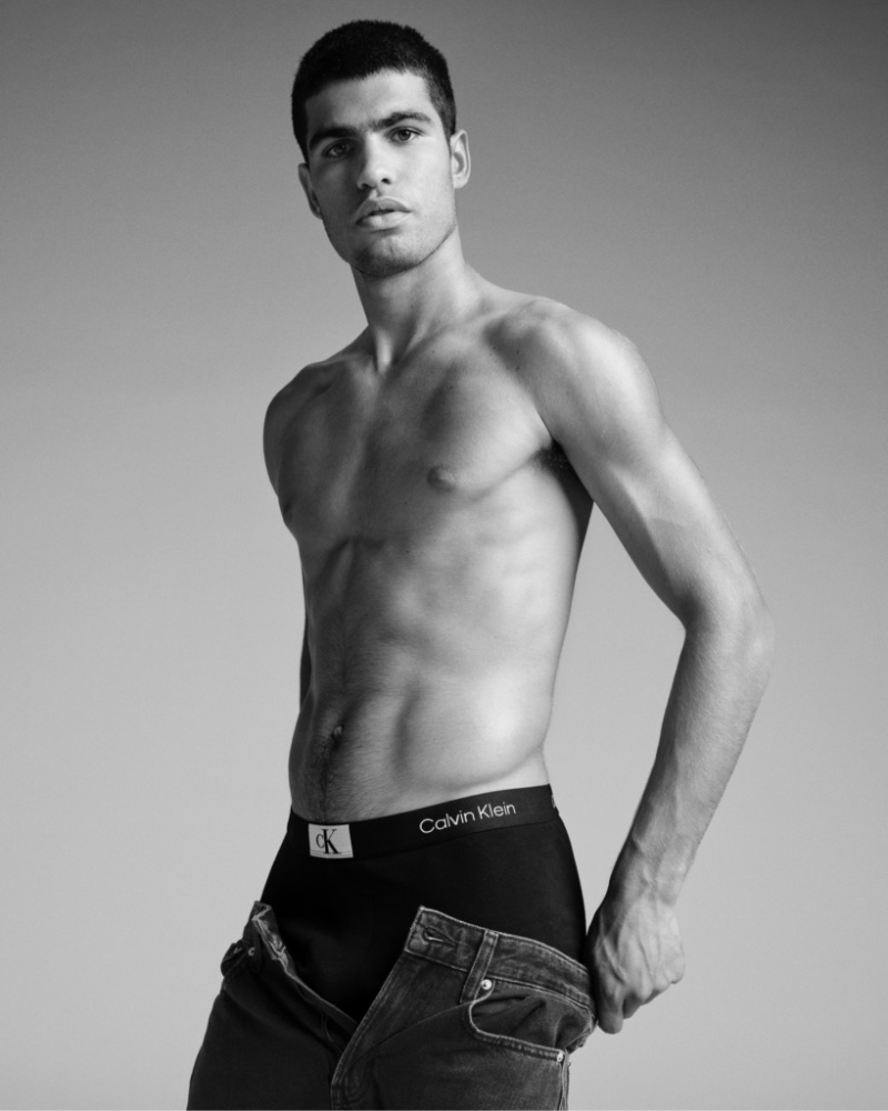 Revealing a glimpse of his Calvin Klein 1996 trunks, Carlos Alcaraz also wears the brand's 90's Loose Jean for its Calvins or Nothing campaign.