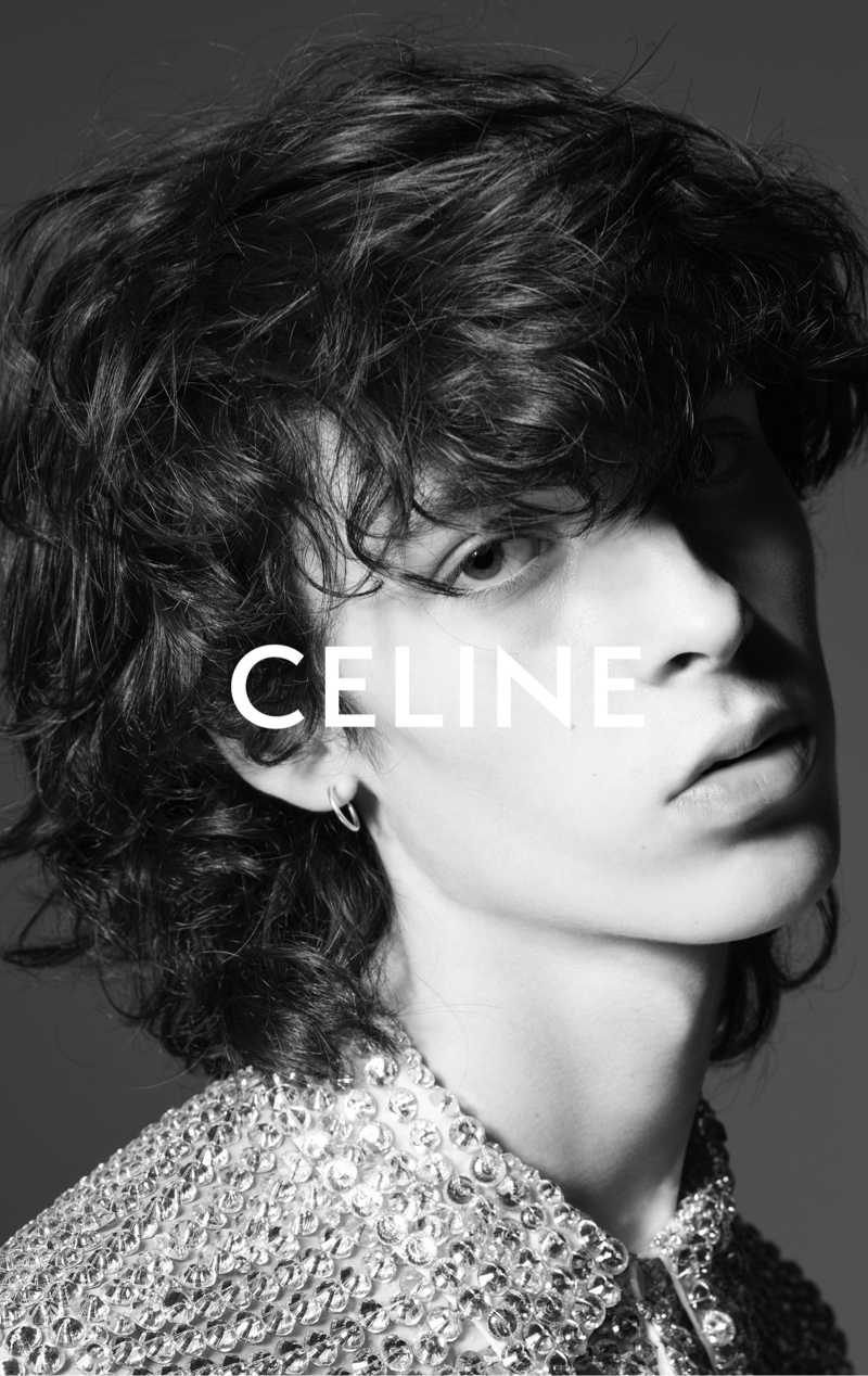 Model Artie Aylott is ready for his close-up in an embroidered shirt for Celine Homme's summer 2023 campaign. 
