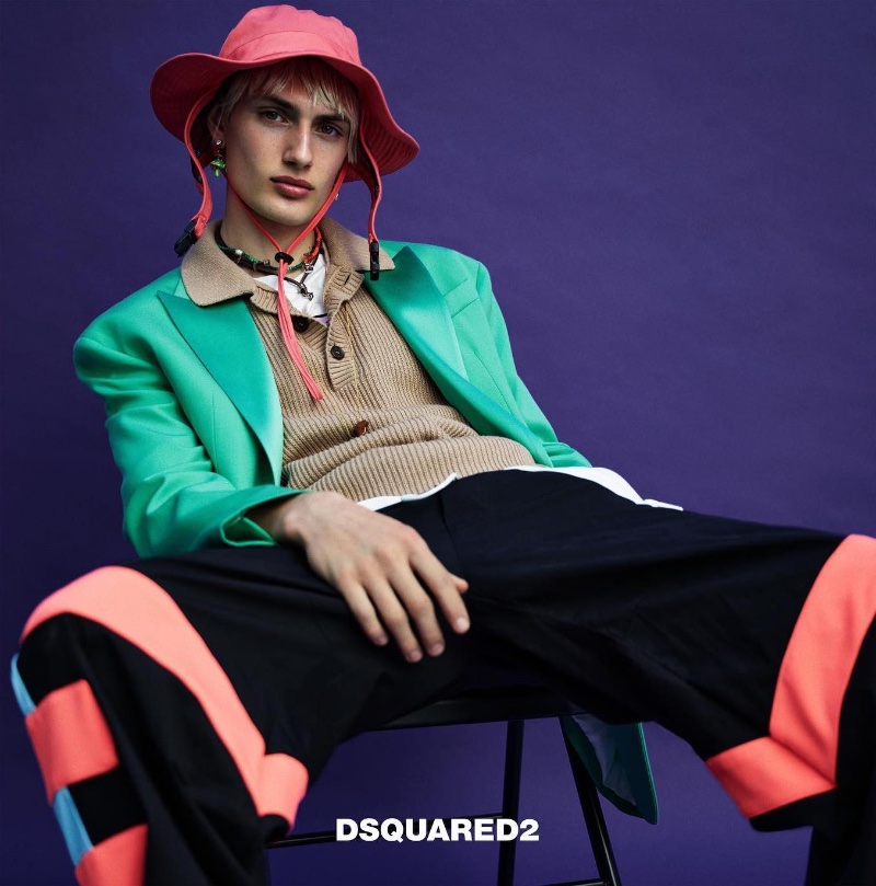 Going for a bleached blond summer look and rocking vibrant colors, Thatcher Thornton fronts Dsquared2's spring-summer 2023 men's campaign.
